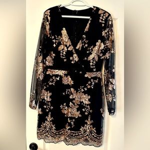 Black and gold sequins V neck cocktail dress.